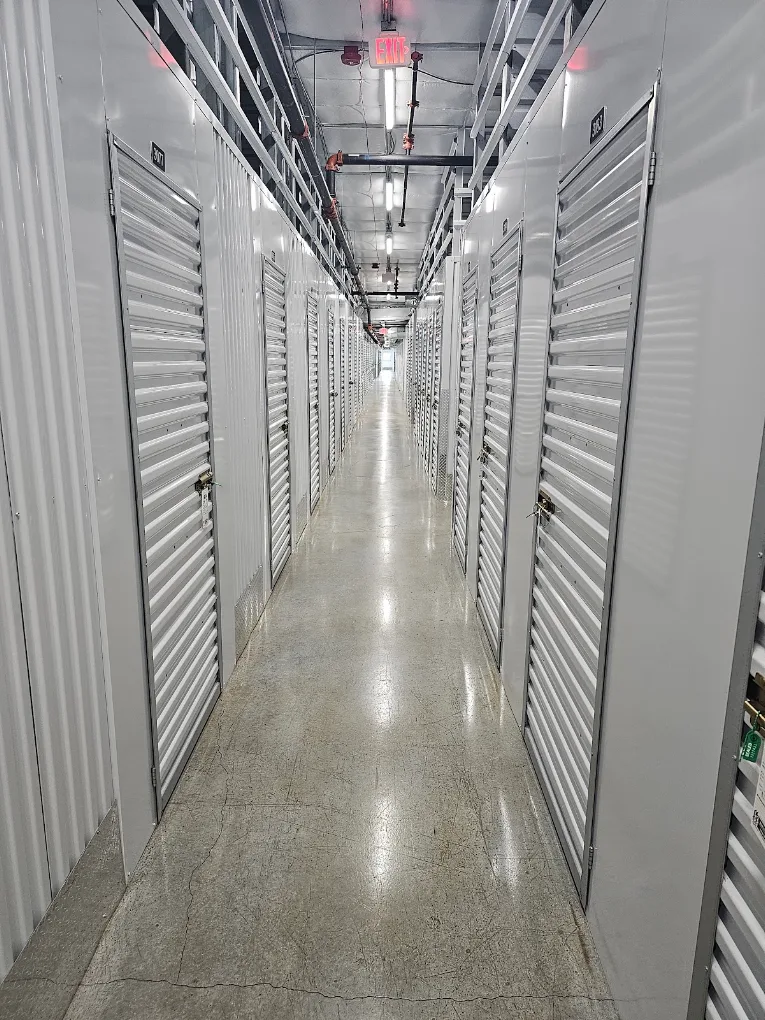 Interior storage unit hallway with roll-up doors